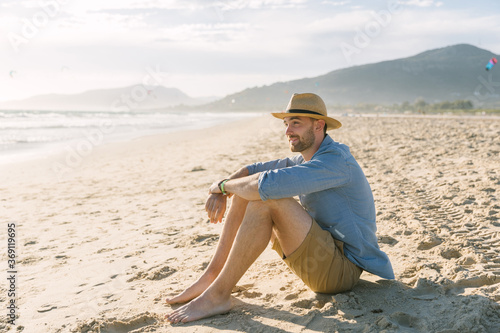 Young man enjoying at the beach