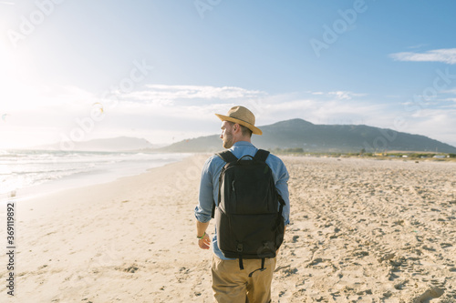 Young man enjoying at the beach photo