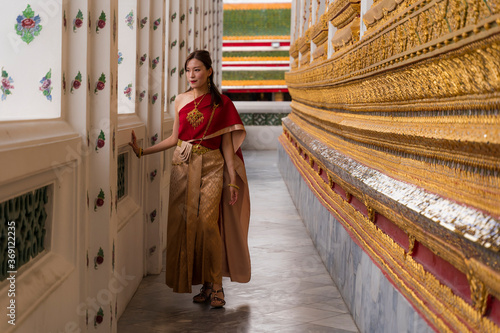Asian woman visiting a temple in Thailand