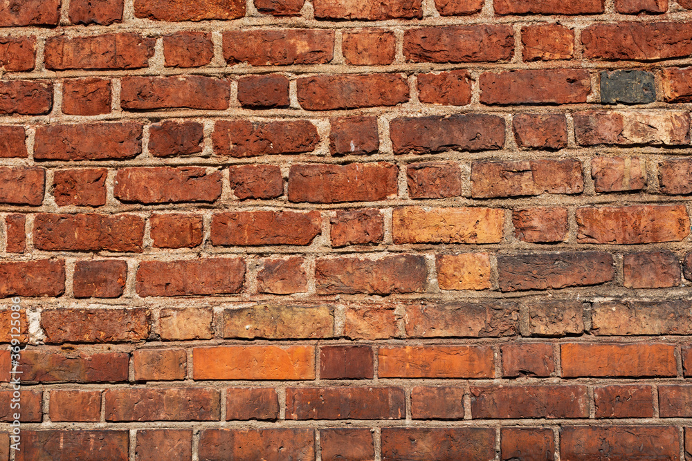Background of stone wall texture. The surface of the stones is brown Background of stone wall texture. The surface of the stones is brown