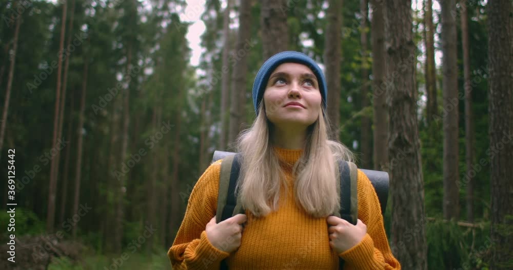 Slow motion: Young woman hiking in forest. Hiker camping in woods. Tourist walking along the river. 4K video shooting by handheld gimbal. Slow motion: Young woman hiking in forest. Hiker camping in woods. Tourist walking along the river. 4K video shooting by handheld gimbal.
