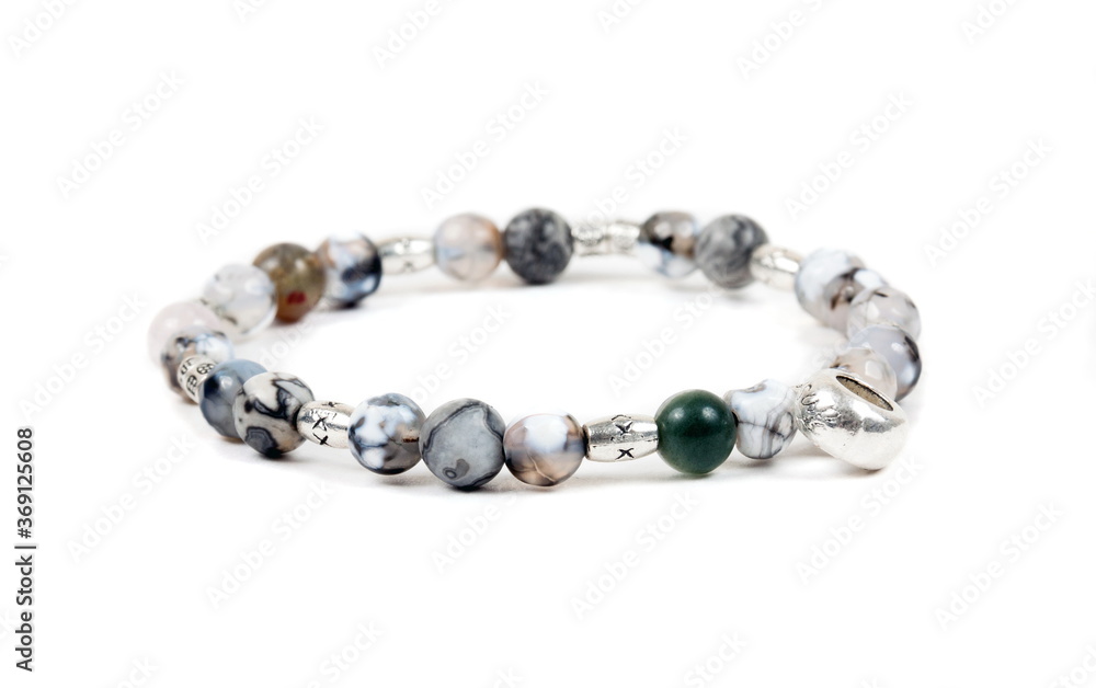 Beaded bracelet on the white surface Beaded bracelet on the white surface