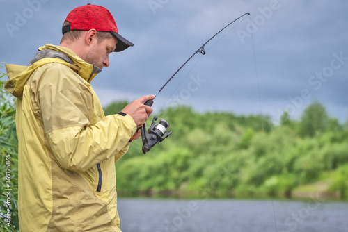 fisherman fishing in the river. Amateur fishing