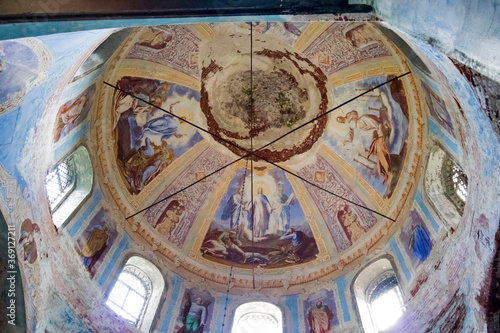 Remains of frescoes on the wall of an abandoned church. © elenarostunova