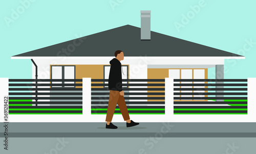 
A male character goes along the sidewalk past a one-story house