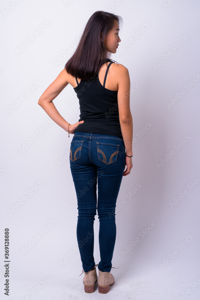 Full body shot rear view of young beautiful Asian woman Full body shot rear view of young beautiful Asian woman