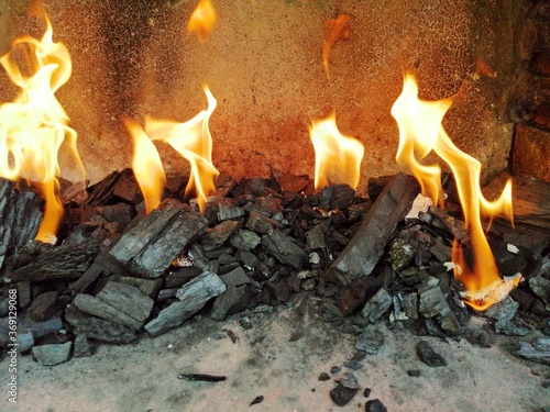 fire and flames in the fireplace barbeque close up