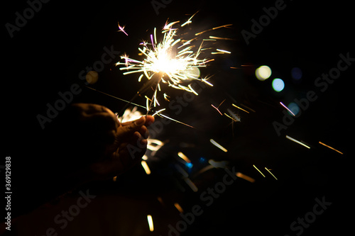Sparklers burning at night in new year