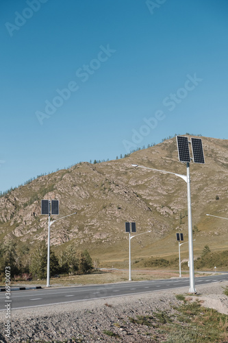 Solars panels on pillars along rhe road on the countryside. photo