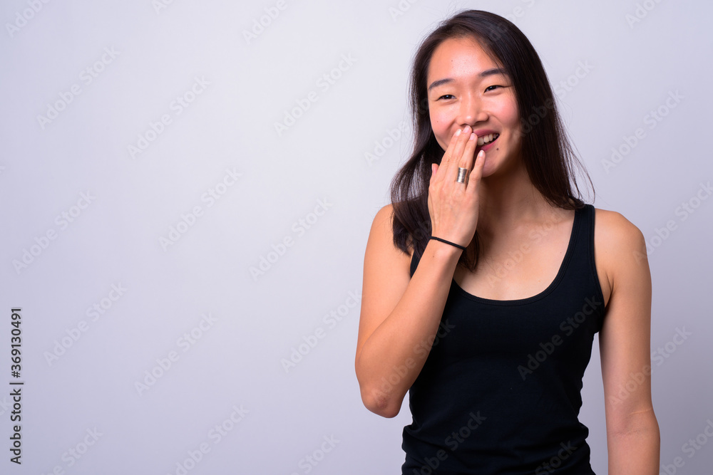 Portrait of happy young beautiful Asian woman Portrait of happy young beautiful Asian woman