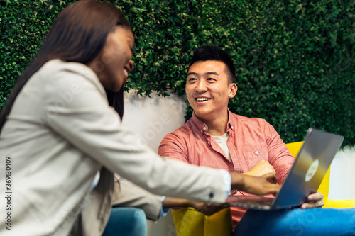 Group of young modern people planning strategy