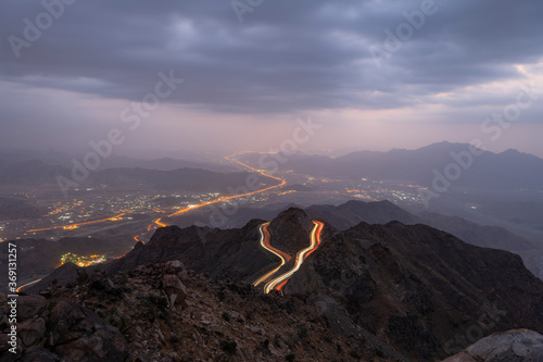 Traffic light trails wrapped around mountain on the zig zag road in Al Hada, Taif region of Saudi Arabia photo