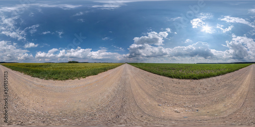 Full spherical seamless hdri panorama 360 degrees angle view on no traffic white sand gravel road among fields with clear sky with beautiful clouds in equirectangular projection, VR AR content