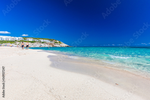 Fototapeta Naklejka Na Ścianę i Meble -  CALA MESQUIDA, MALLORCA, SPAIN - 19 July 2020: People enjoying beautiful sandy beach of on Mallorca, Mediterranean Sea, Spain.