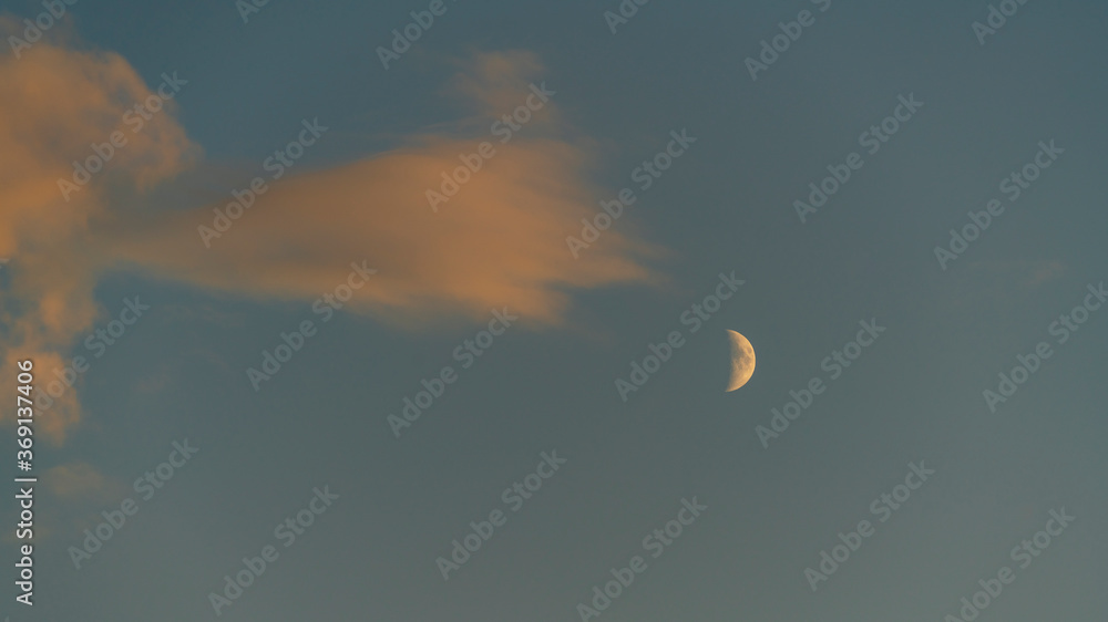 Moon and sunset clouds. Travel destination Russia