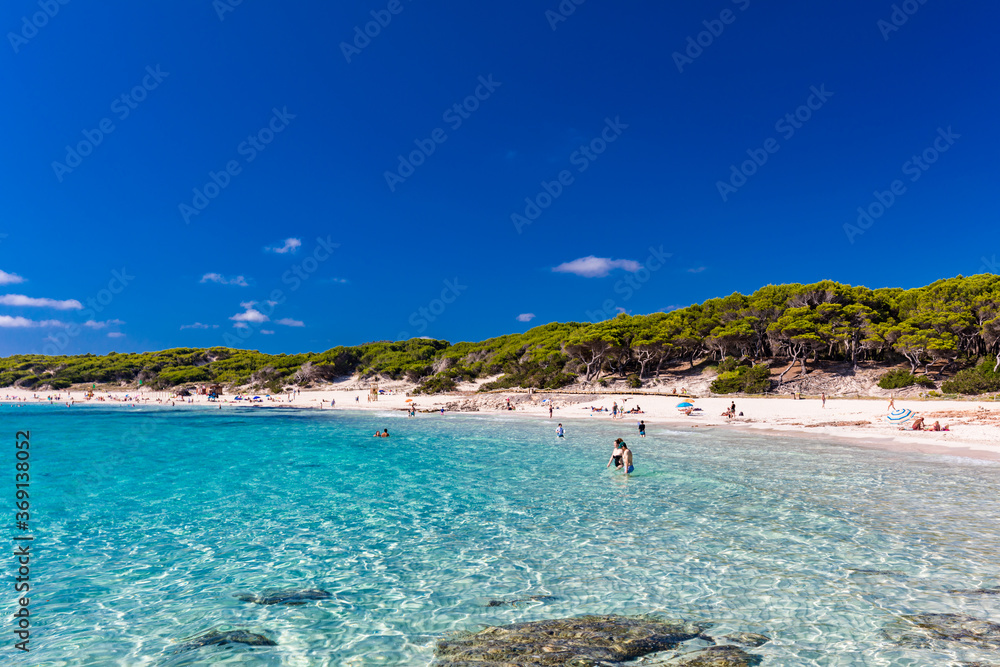 Fototapeta premium CALA AGULLA, MALLORCA, SPAIN - 21 July 2020: People enjoying summer on the popular beach on Mallorca, Balearic Islands.