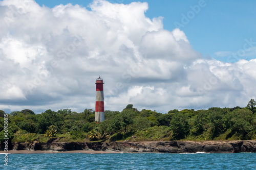 lighthouse standing at the coast of ladrilleros, colombia © PlataRoncallo
