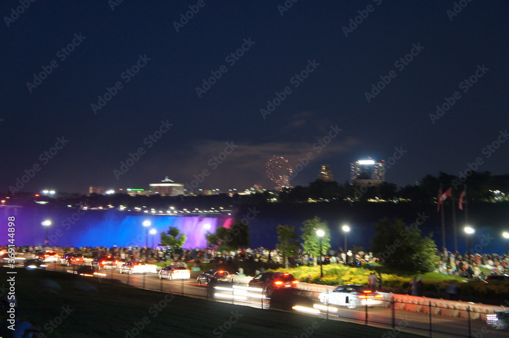 Fototapeta premium Fireworks and Illuminated Niagara Falls