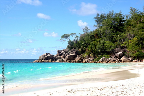 Beautiful paradise beach in Seychelles Island with white sand beach, turquoise blue water, green vegetation and granit rocks, Seychelles. La Digue, Mahe, Praslin.