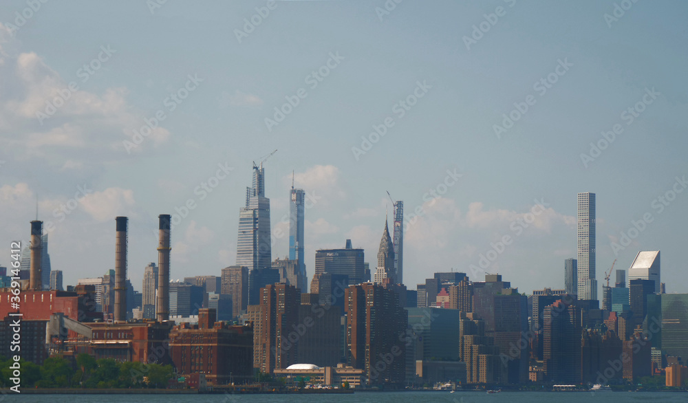 landscape of manhattan midtown NYC with east river at daytime