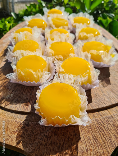 Quindim is a sweet with the ingredients of egg yolk, sugar and grated coconut. They are delicious and perfect for a beautiful dessert. photo