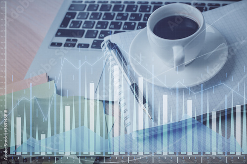 Double exposure of forex chart drawing and desktop with coffee and items on table background. Concept of financial market trading