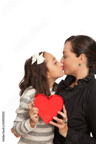 Love between mother and daughter concept. Mother and daughter holding a red heart.