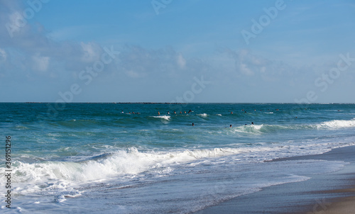 Fototapeta Naklejka Na Ścianę i Meble -  Surfing at Wrightsville Beach Before Hurricane Isaias