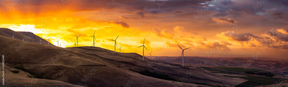 Beautiful Panoramic Landscape View of Wind Turbines on a Windy Hill Beautiful Panoramic Landscape View of Wind Turbines on a Windy Hill