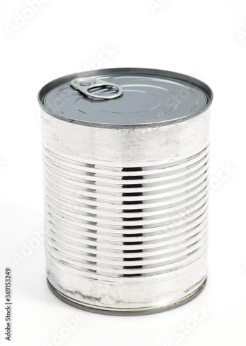 TIN OR CAN AGAINST WHITE BACKGROUND