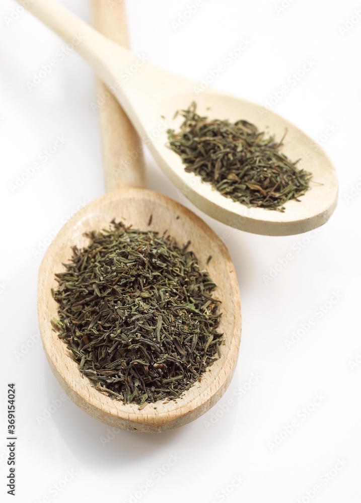 PROVENCIAL THYME IN WOODEN SPOON AGAINST WHITE BACKGROUND PROVENCIAL THYME IN WOODEN SPOON AGAINST WHITE BACKGROUND