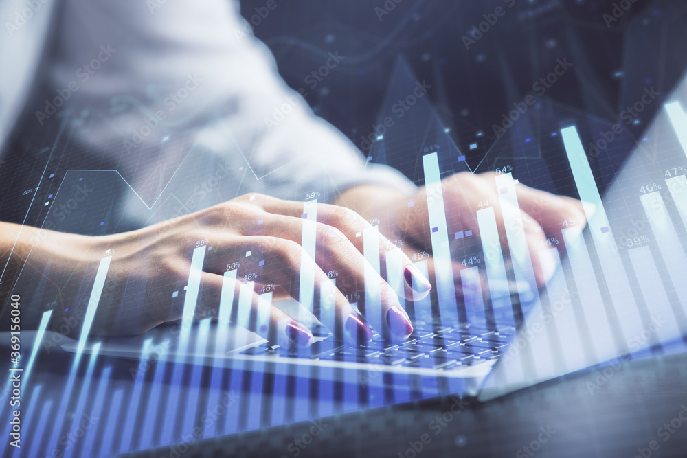 Double exposure of businesswoman hands typing on computer and forex chart hologram drawing. Financial analysis concept. Double exposure of businesswoman hands typing on computer and forex chart hologram drawing. Financial analysis concept.