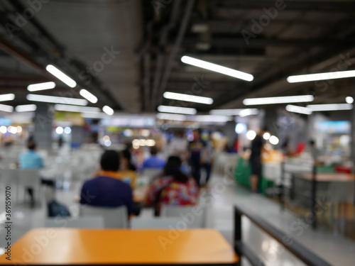 blurred of people at food court for background.