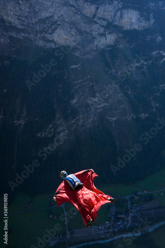BASE jumper flying in his wingsuit photo