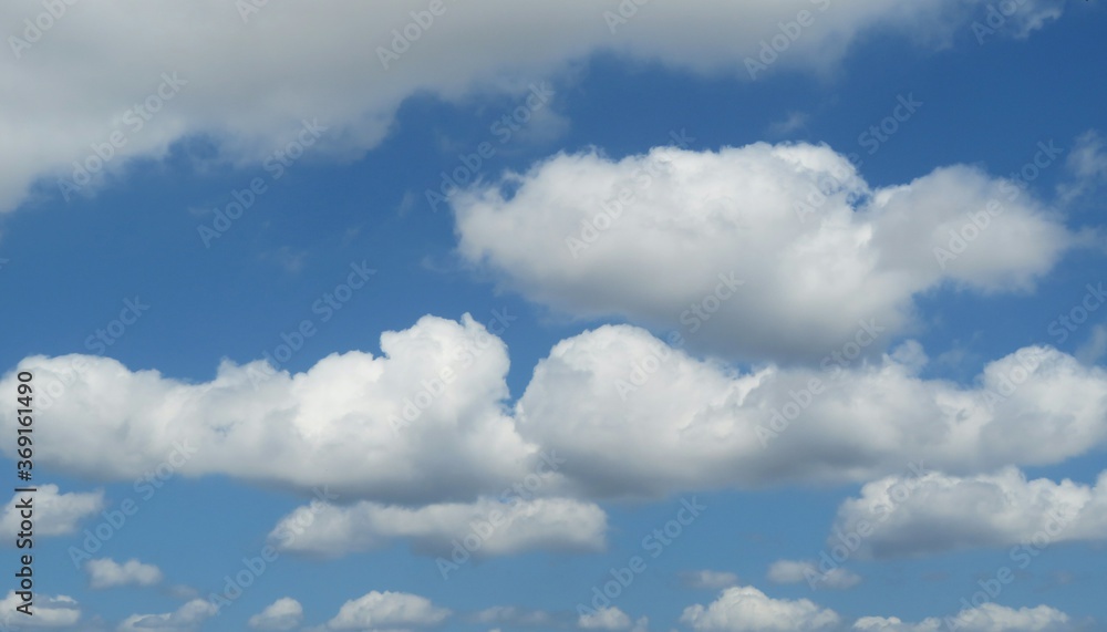 Beautiful fluffy clouds in blue sky, natural background Beautiful fluffy clouds in blue sky, natural background