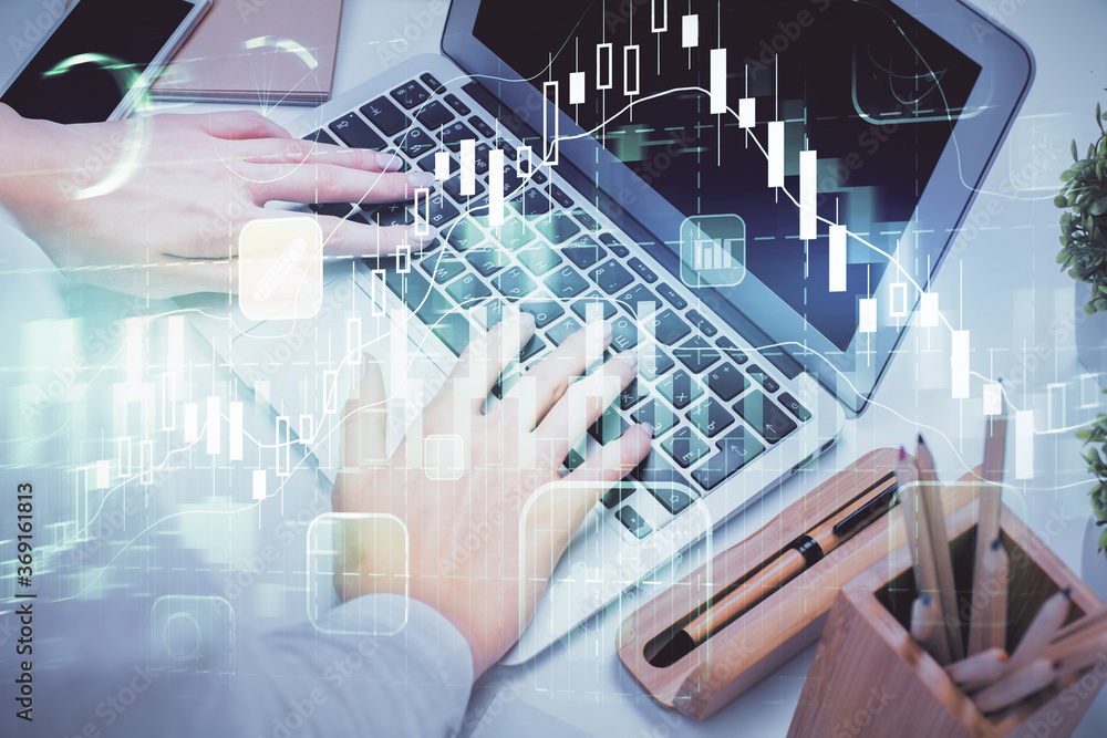Double exposure of woman hands typing on computer and forex chart hologram drawing. Stock market invest concept. Double exposure of woman hands typing on computer and forex chart hologram drawing. Stock market invest concept.