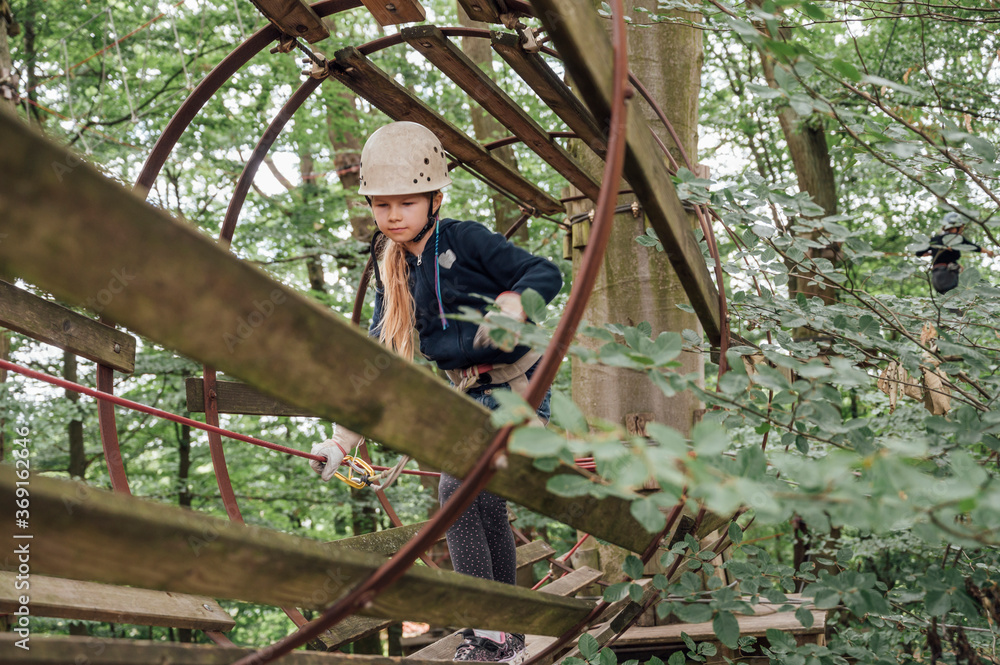 People: Girl at a high wire park People: Girl at a high wire park