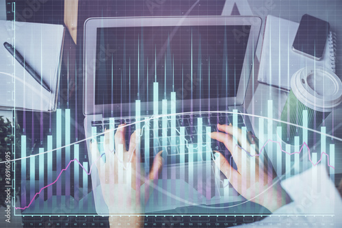 Double exposure of woman hands typing on computer and forex chart hologram drawing. Stock market invest concept. © peshkova