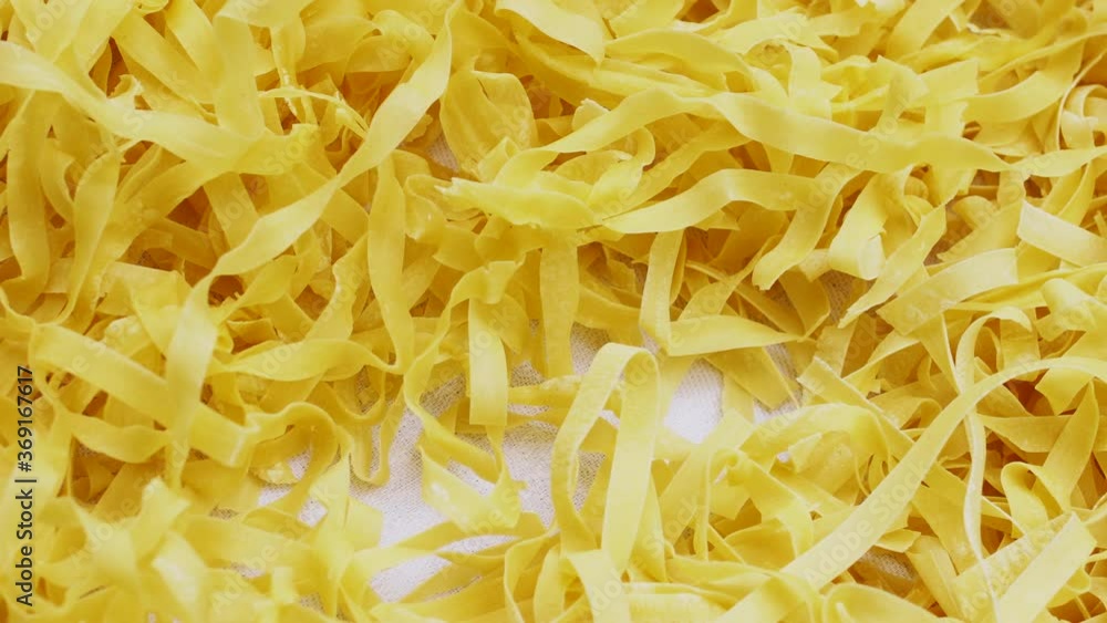 Homemade noodles drying on a table Homemade noodles drying on a table