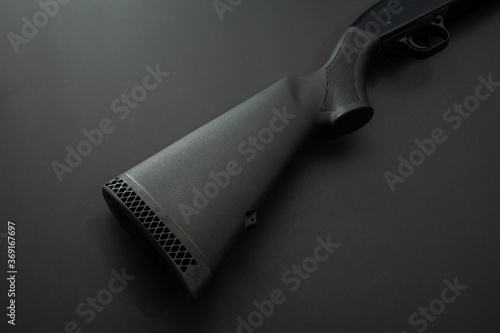 Canvas Print Close up of a 12 gauge shotgun on black background.