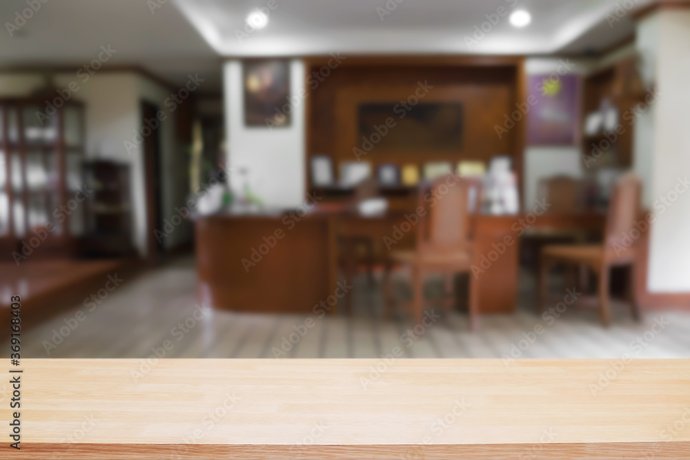 Empty wooden desk space and blurry background of home window for product display montage. Empty wooden desk space and blurry background of home window for product display montage.