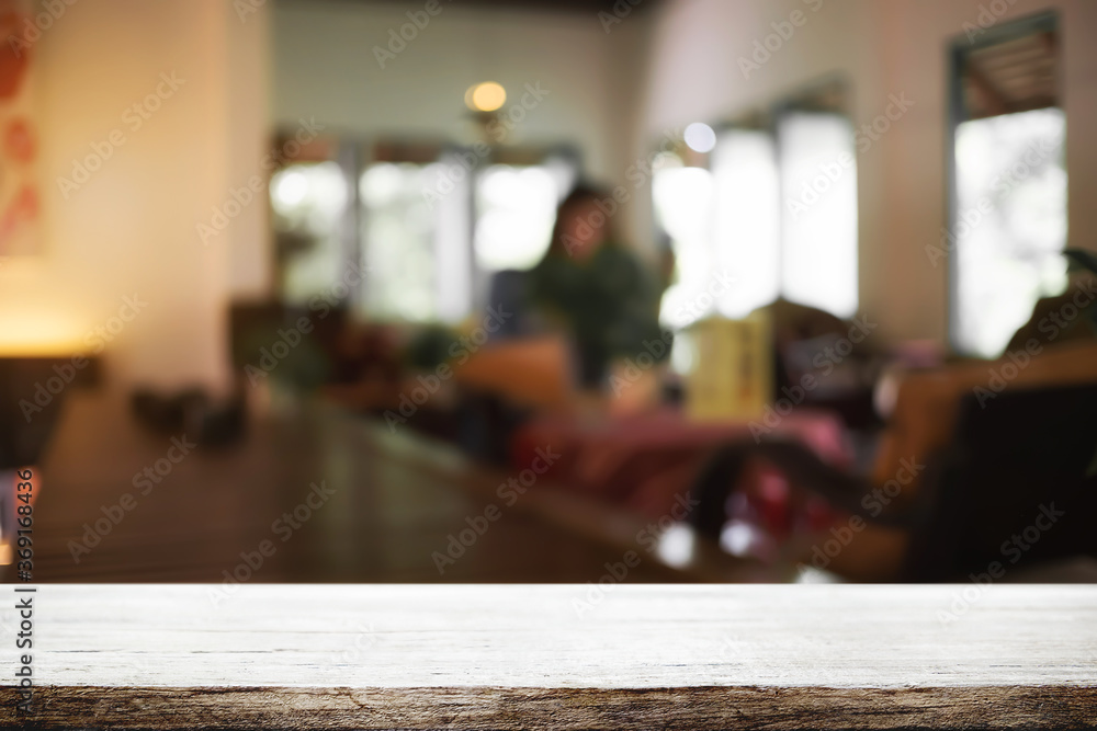 Empty wooden desk space and blurry background of coffee shop or Restaurant for product display montage. Empty wooden desk space and blurry background of coffee shop or Restaurant for product display montage.