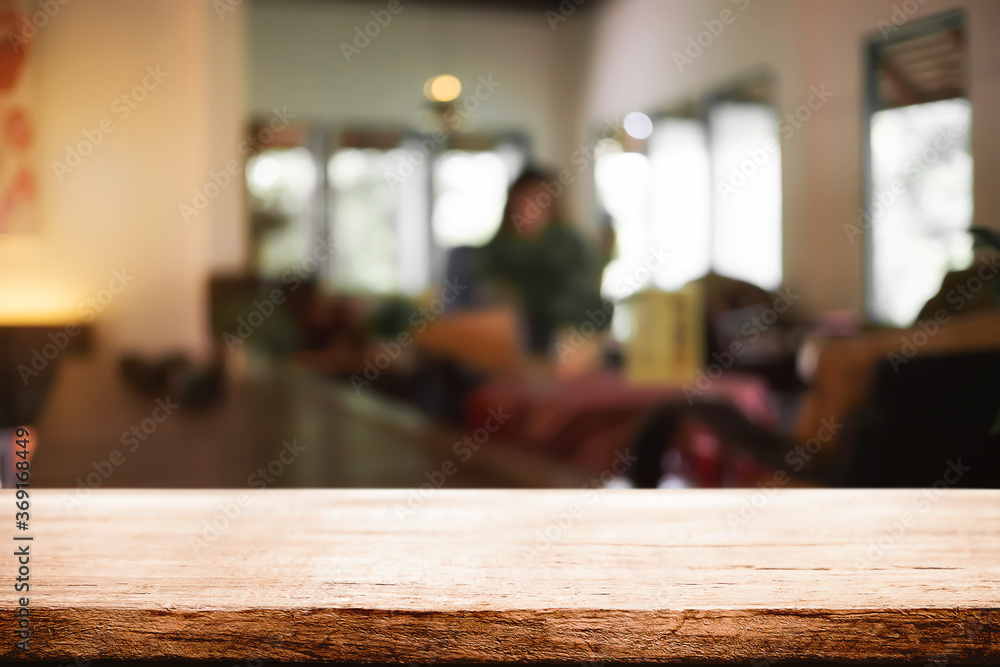 Empty wooden desk space and blurry background of coffee shop or Restaurant for product display montage. Empty wooden desk space and blurry background of coffee shop or Restaurant for product display montage.