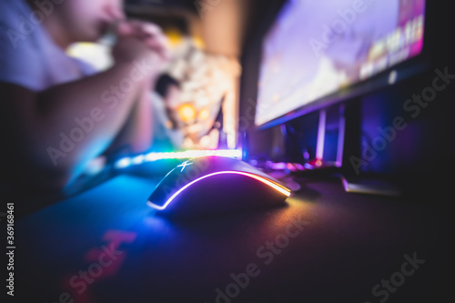 Cyber sport e-sports tournament  team of professional gamers  close-up on gamer s hands on a keyboard  pushing button  gamers playing in competitive moba strategy fps game on a cyber games arena club