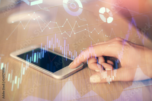 Double exposure of forex chart sketch hologram and woman holding and using a mobile device. Financial market concept.