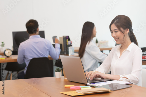 Business asian woman happy working job on laptop in office.