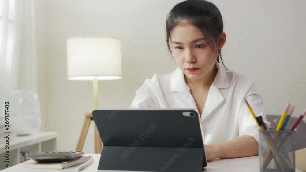 Asian business woman have a neck pain because using the laptop computer and working for a long time. This may be the cause of Office Syndrome. Asian business woman have a neck pain because using the laptop computer and working for a long time. This may be the cause of Office Syndrome.