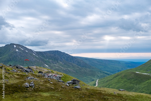 Paragliders depart from Summit Lake, in Hatcher Pass.