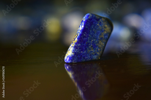 Fototapeta Naklejka Na Ścianę i Meble -  Lapis Lazuli is a beautiful blue gemstone. On areas with reflected light