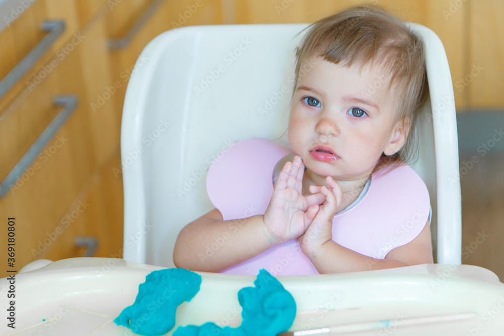 girl sculpts from plasticine. a child makes a hedgehog craft. development of fine motor skills with toothpicks girl sculpts from plasticine. a child makes a hedgehog craft. development of fine motor skills with toothpicks